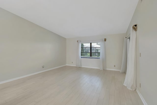 empty room with light hardwood / wood-style floors