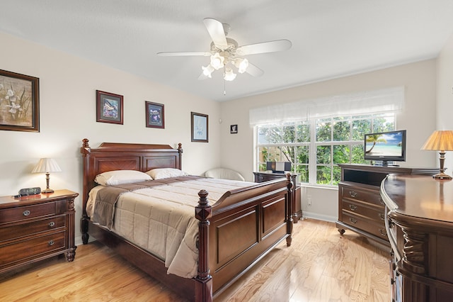 bedroom with ceiling fan and light hardwood / wood-style flooring