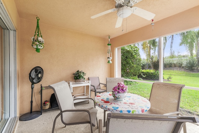 view of patio featuring ceiling fan