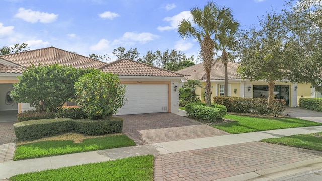 mediterranean / spanish-style home featuring a garage