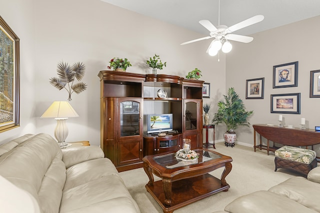 carpeted living room with vaulted ceiling and ceiling fan