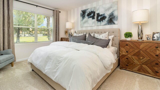bedroom with baseboards and carpet flooring