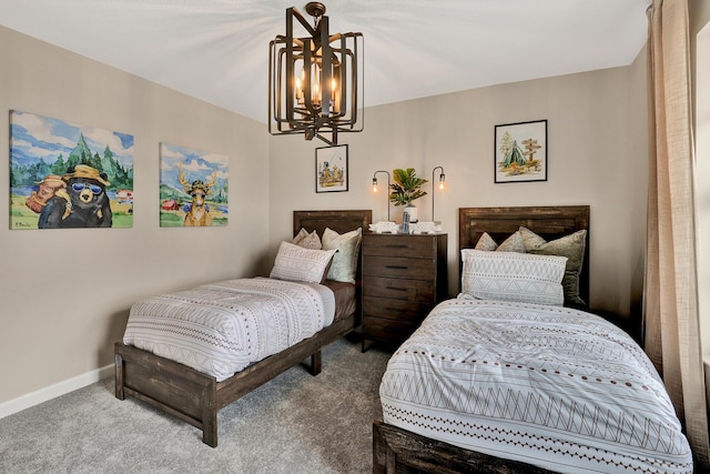 carpeted bedroom with baseboards and a chandelier