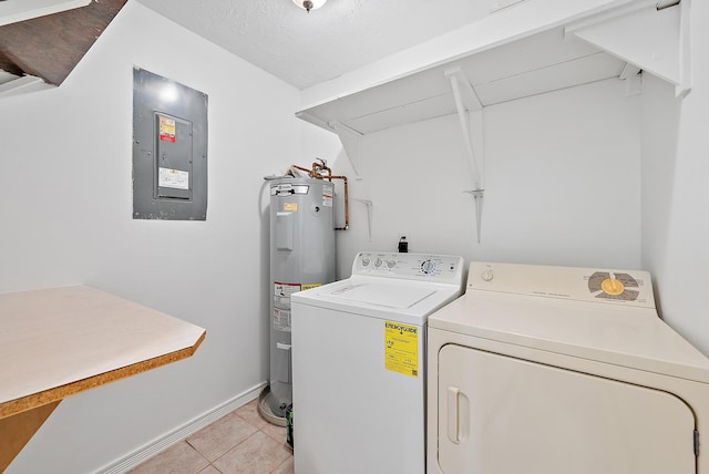 washroom featuring a textured ceiling, water heater, light tile patterned floors, washing machine and clothes dryer, and electric panel