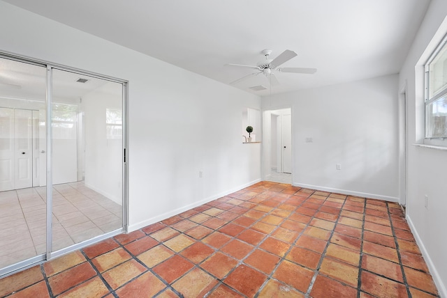 spare room featuring ceiling fan