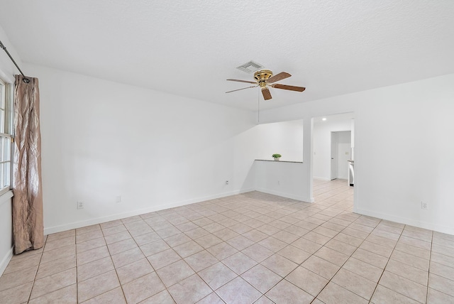 tiled empty room with ceiling fan