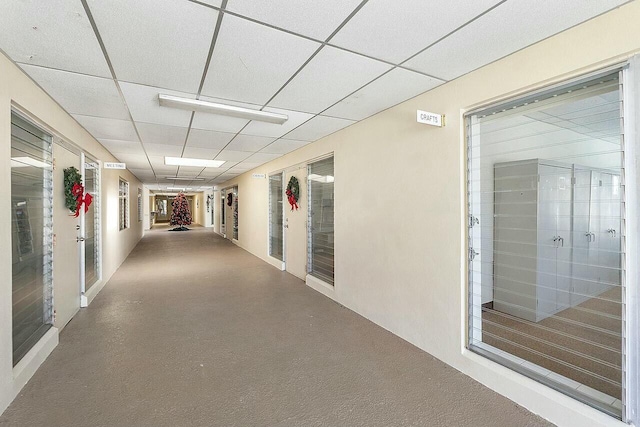 hallway with a drop ceiling