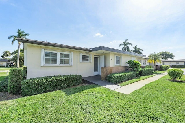 ranch-style house with a front yard