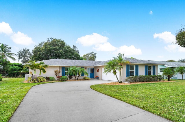 ranch-style home with a front lawn