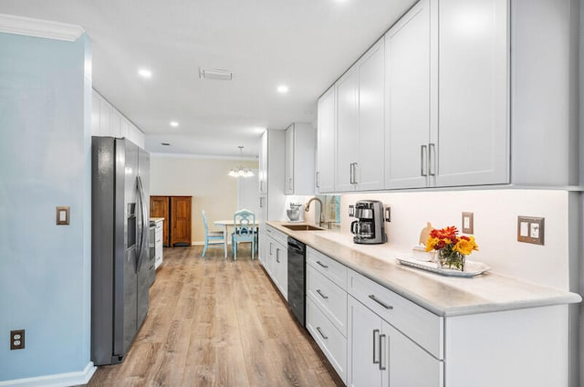 kitchen with dishwasher, light hardwood / wood-style flooring, stainless steel fridge, crown molding, and white cabinets