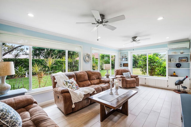 living room featuring a wall mounted AC, ceiling fan, plenty of natural light, and light wood-type flooring