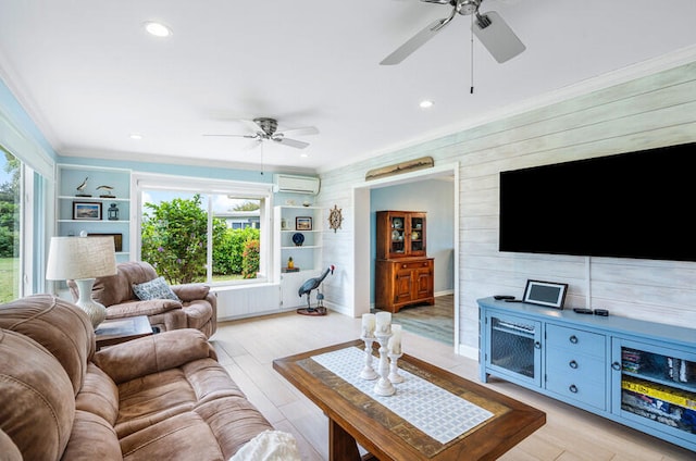 living room featuring light wood-type flooring, a wall unit AC, ceiling fan, and wood walls