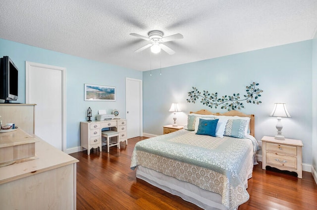 bedroom featuring a textured ceiling, ceiling fan, and dark wood-type flooring