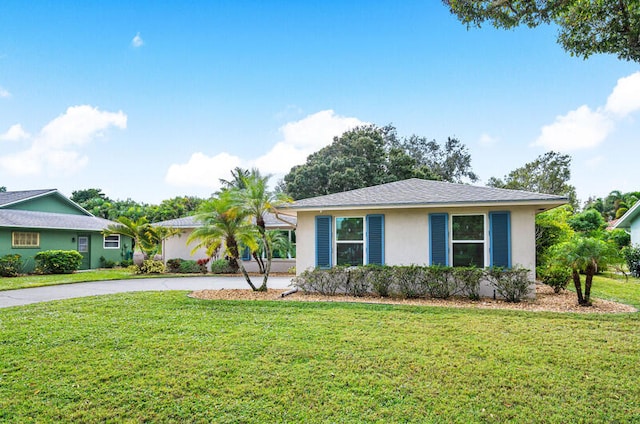 ranch-style house featuring a front lawn