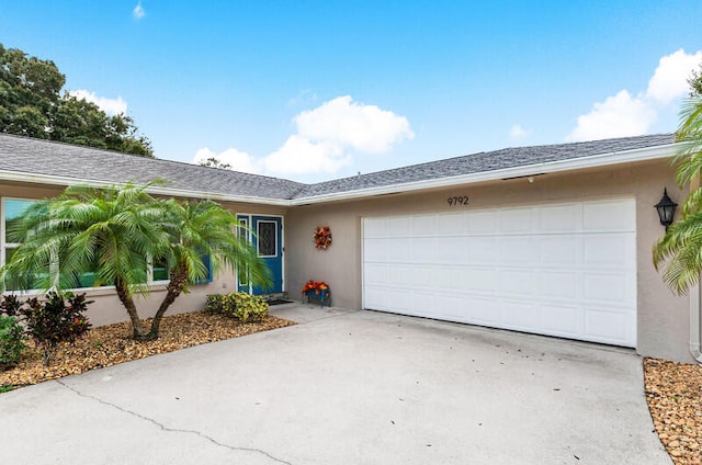 single story home featuring a garage