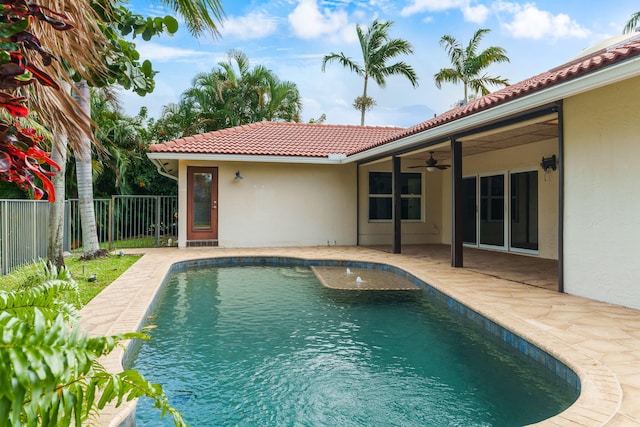 view of pool featuring ceiling fan and a patio