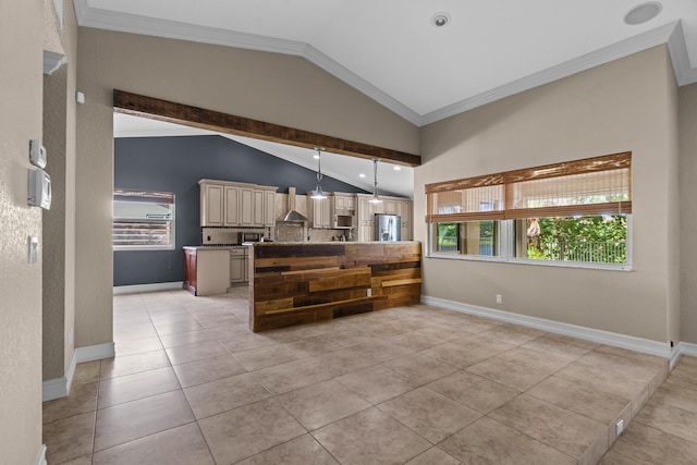 kitchen featuring pendant lighting, stainless steel appliances, vaulted ceiling, light tile patterned floors, and crown molding