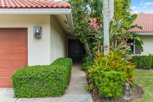 property entrance featuring a garage