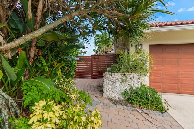 view of property exterior with a garage