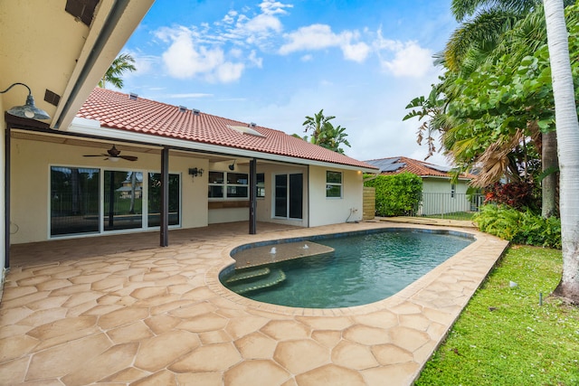 view of pool with a patio area and ceiling fan