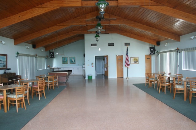 dining space featuring beamed ceiling, high vaulted ceiling, and wood ceiling