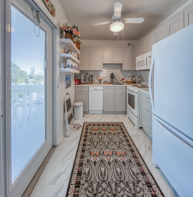 kitchen featuring tasteful backsplash, ceiling fan, sink, and white appliances