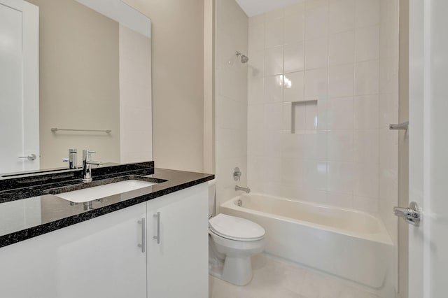 full bathroom with vanity, tiled shower / bath combo, and toilet