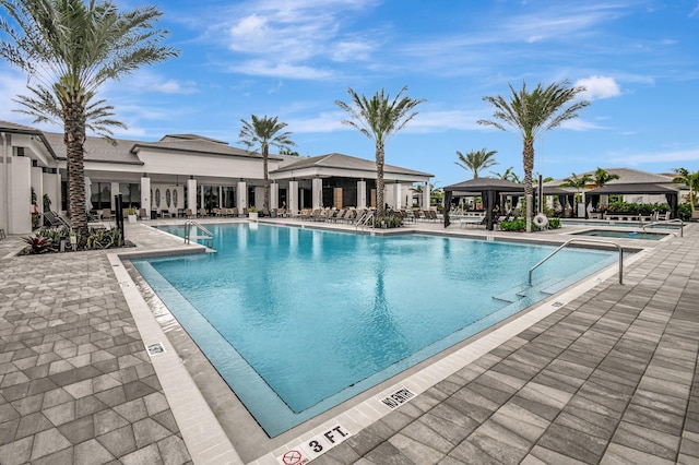 view of swimming pool featuring a gazebo and a patio