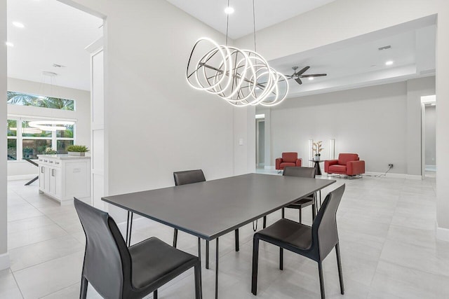 tiled dining area with ceiling fan