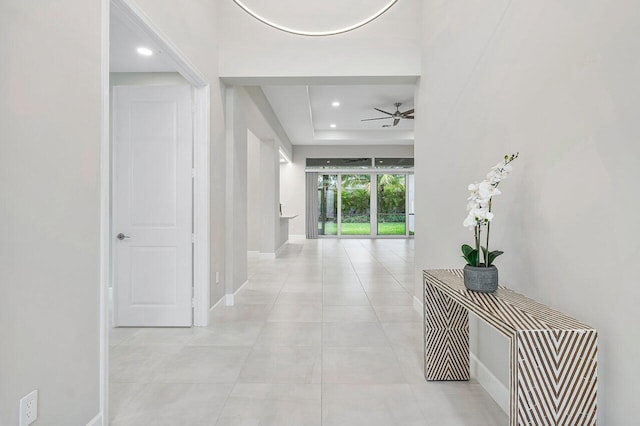 hall featuring light tile patterned flooring