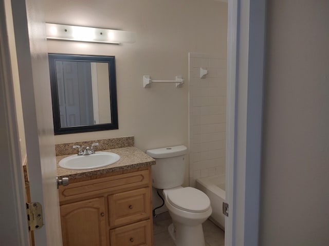 bathroom featuring tile patterned flooring, vanity, and toilet