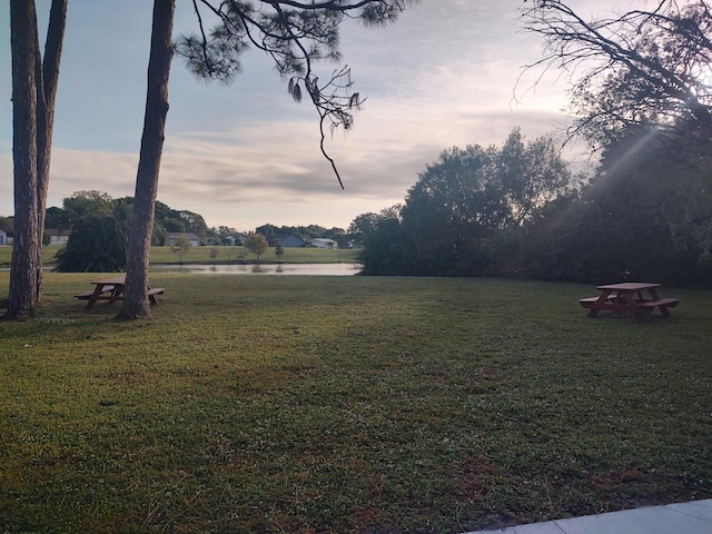 yard at dusk with a water view