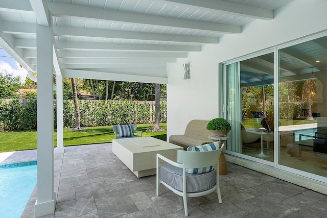 view of patio / terrace with a fenced in pool