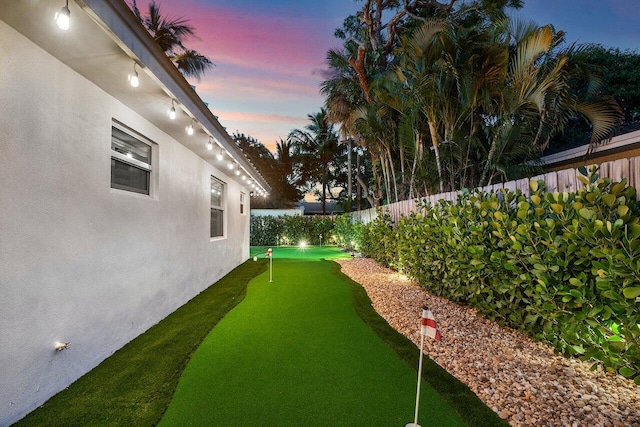 view of yard at dusk