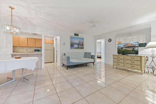 435 Pine Glen Ln Unit B-2, Greenacres, FL 33463 - living area featuring a chandelier, light tile patterned floors, and ceiling fan