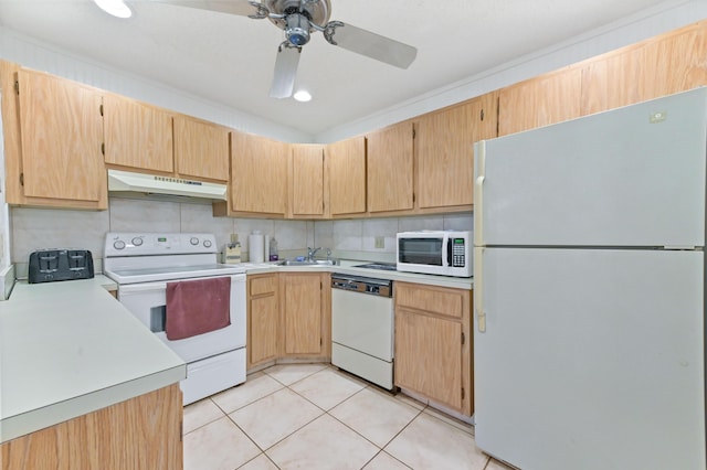 435 Pine Glen Ln Unit B-2, Greenacres, FL 33463 - kitchen featuring white appliances, under cabinet range hood, a sink, light countertops, and light tile patterned floors