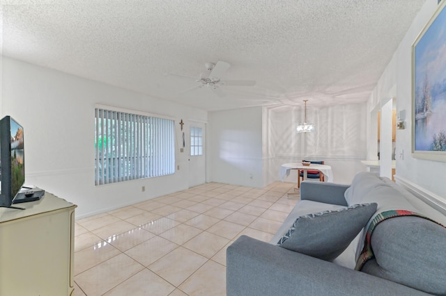 435 Pine Glen Ln Unit B-2, Greenacres, FL 33463 - living area with a textured ceiling, tile patterned floors, a chandelier, and ceiling fan