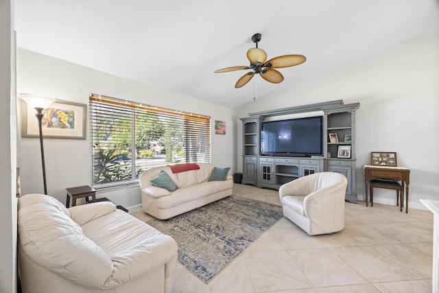 living area with lofted ceiling, light tile patterned floors, baseboards, and ceiling fan