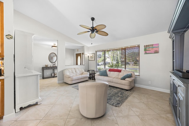 living room featuring light tile patterned floors, ceiling fan, baseboards, and lofted ceiling