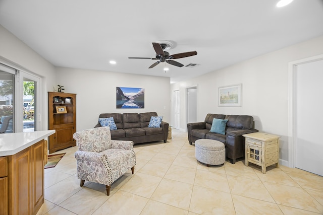 living room with light tile patterned flooring, recessed lighting, visible vents, and ceiling fan