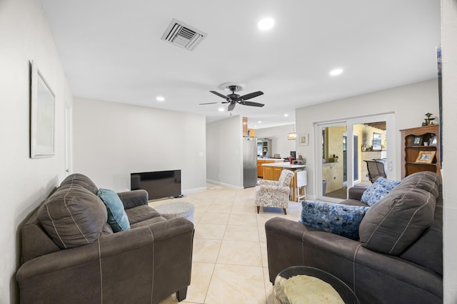 living room with visible vents, a ceiling fan, recessed lighting, light tile patterned flooring, and baseboards