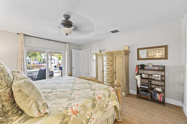 bedroom featuring light wood finished floors, visible vents, baseboards, a ceiling fan, and access to outside