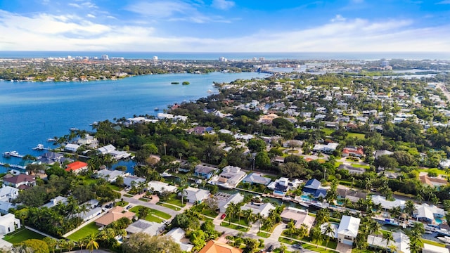 drone / aerial view featuring a water view and a residential view