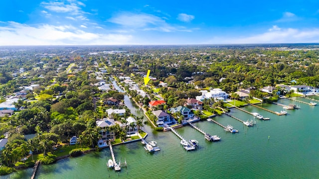 drone / aerial view with a water view and a residential view