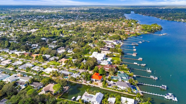 drone / aerial view with a water view and a residential view