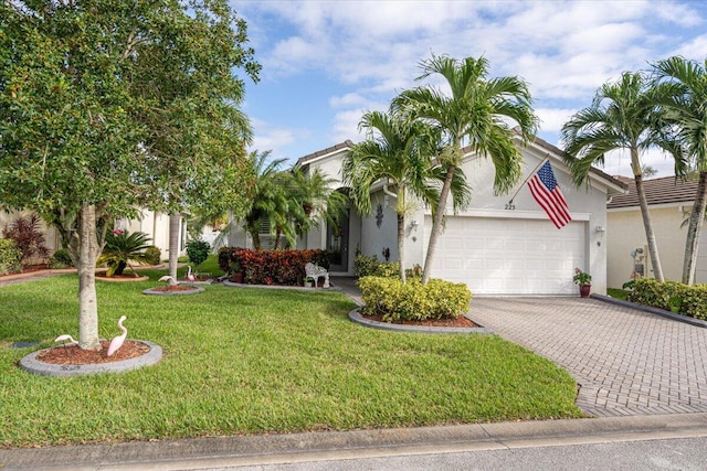 view of front of property featuring a garage and a front lawn