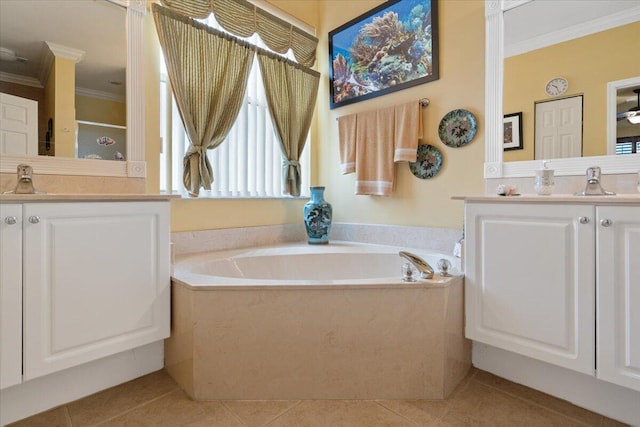 bathroom with tile patterned flooring, vanity, a tub, and crown molding