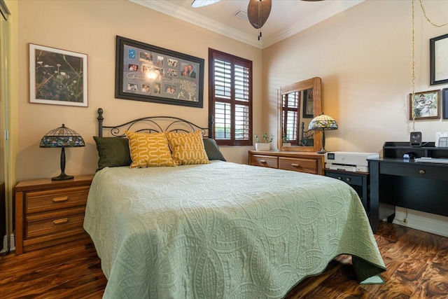 bedroom with ceiling fan, ornamental molding, and dark wood-type flooring