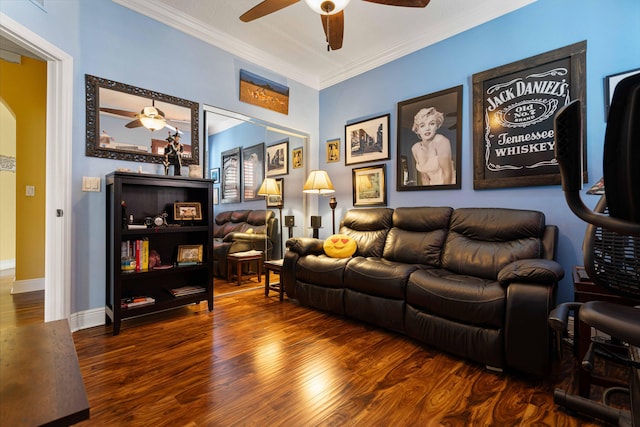 living room featuring ceiling fan, hardwood / wood-style floors, and ornamental molding