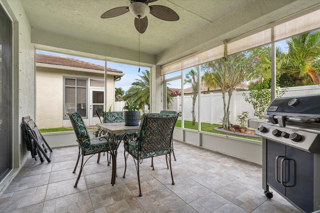 sunroom / solarium with ceiling fan